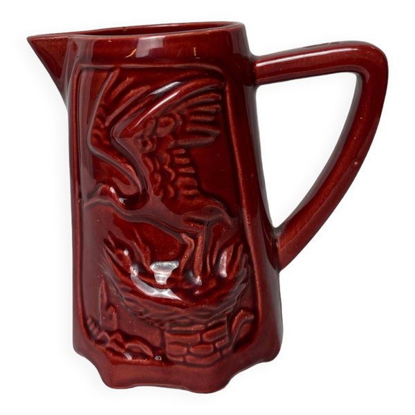 Saint Clément pichet en faïence rouge décor cigogne vers 1940