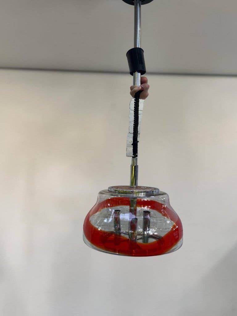 Vintage Murano glass pendant light with orange accent.