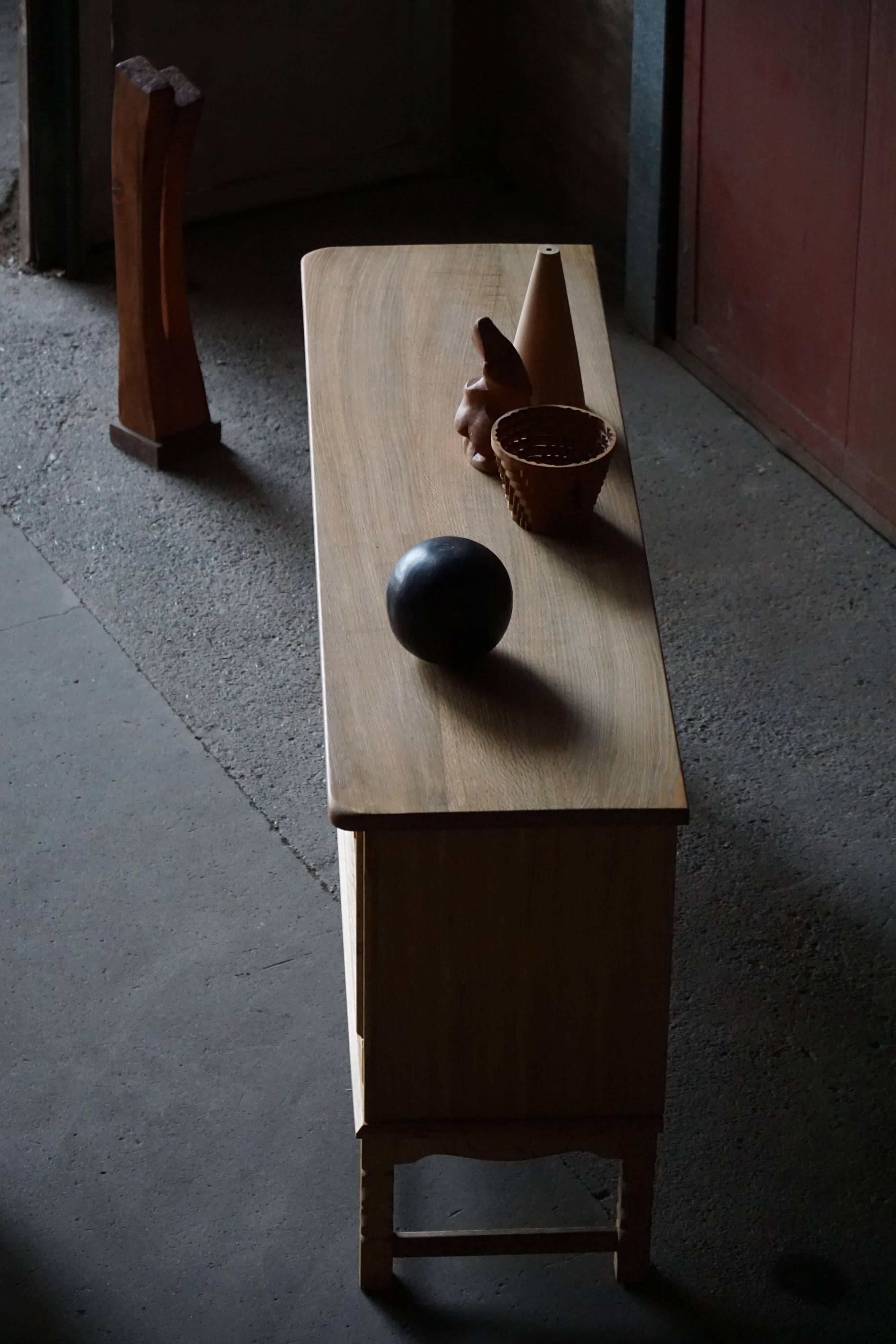 Brutalist Danish enfilade from the mid-century in oak by Henning Kjærnulf, 1960s.
