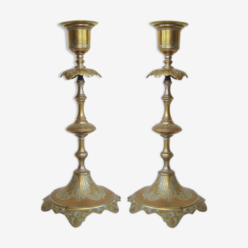 Pair of old engraved metal candlesticks