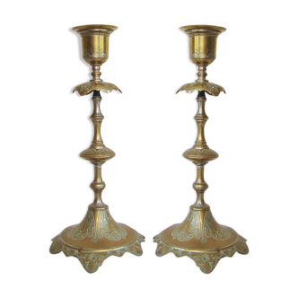 Pair of old engraved metal candlesticks