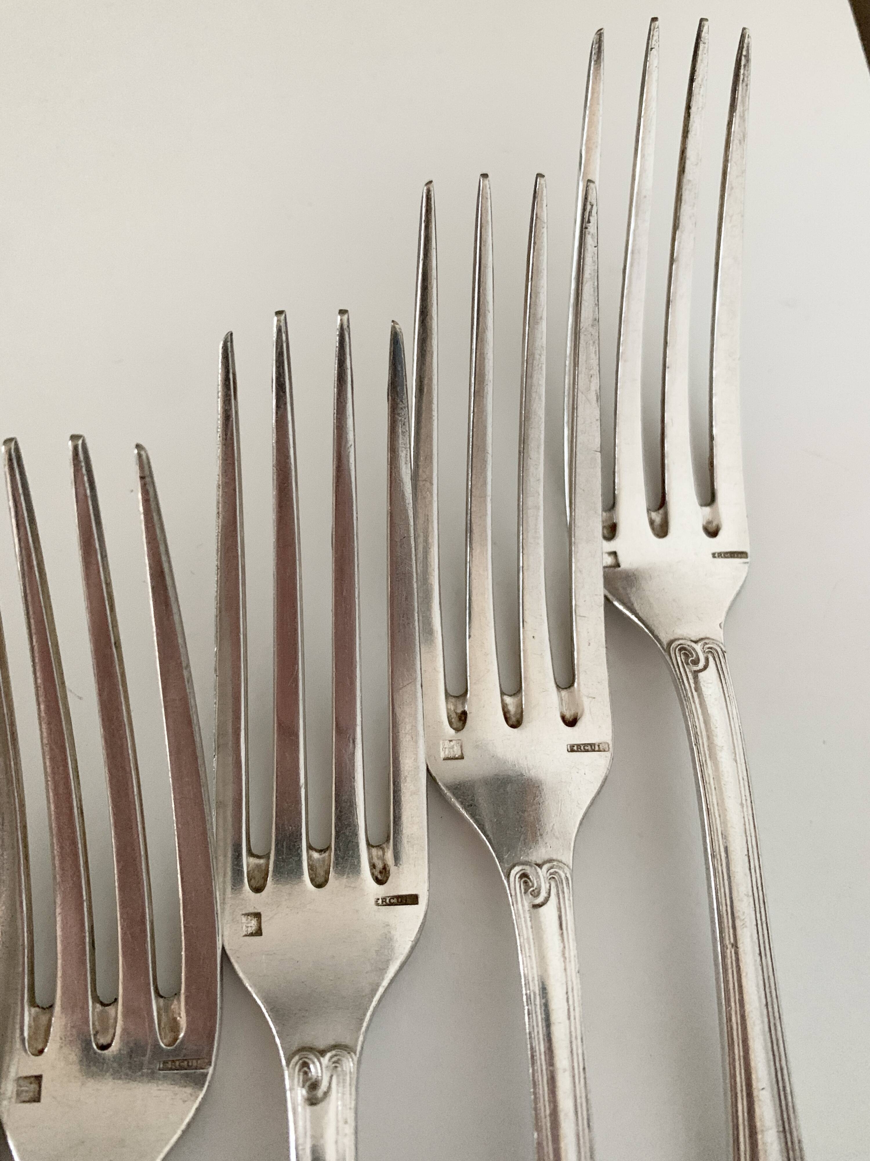 Nine large Ercuis silver-plated forks