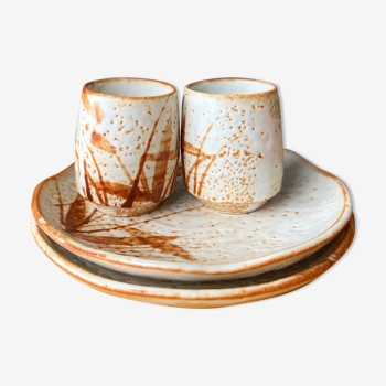 Duo of ceramic cups and plates