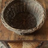Round wicker basket with a patina