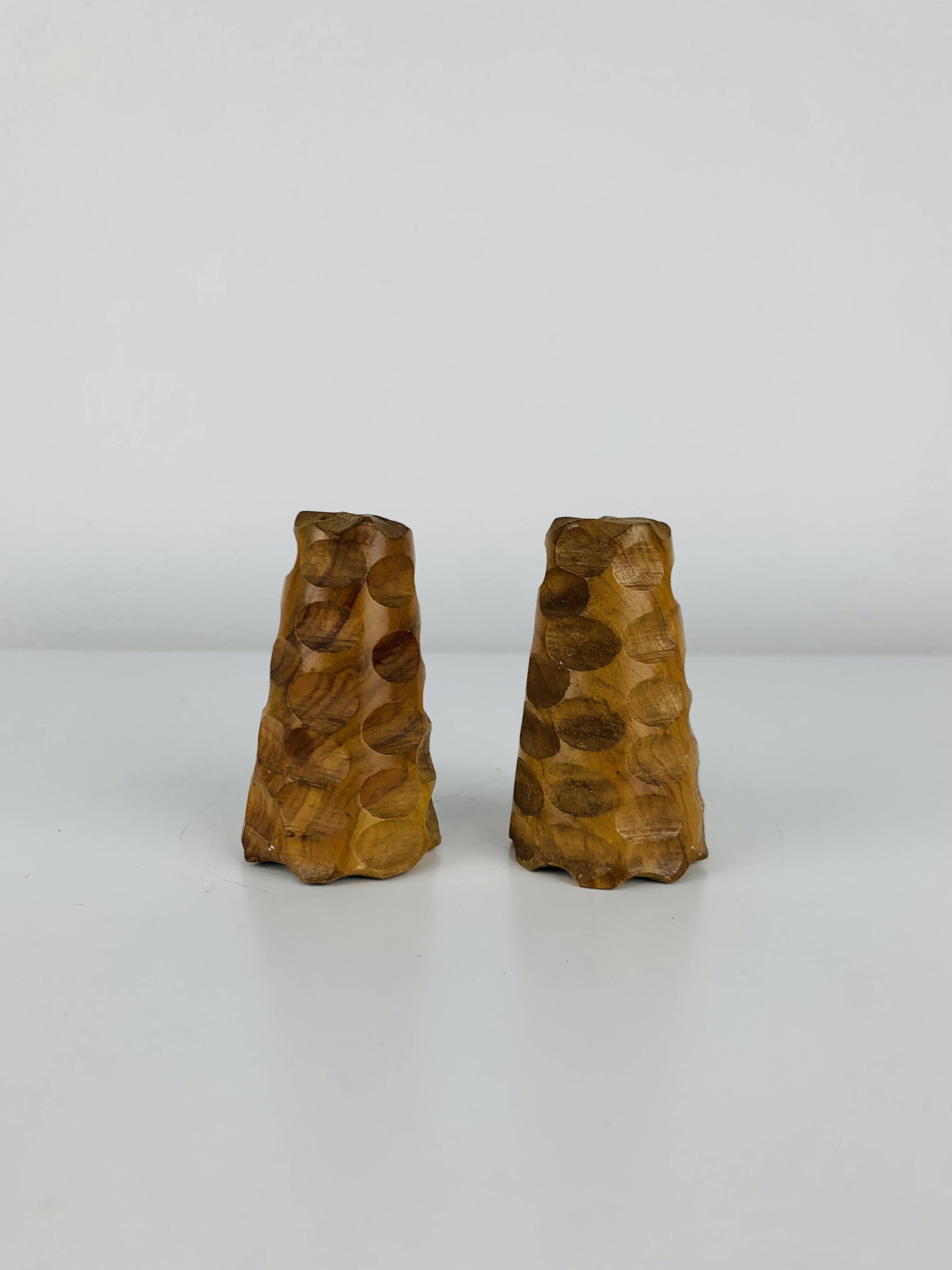 Vintage gouged olive wood salt and pepper shakers.