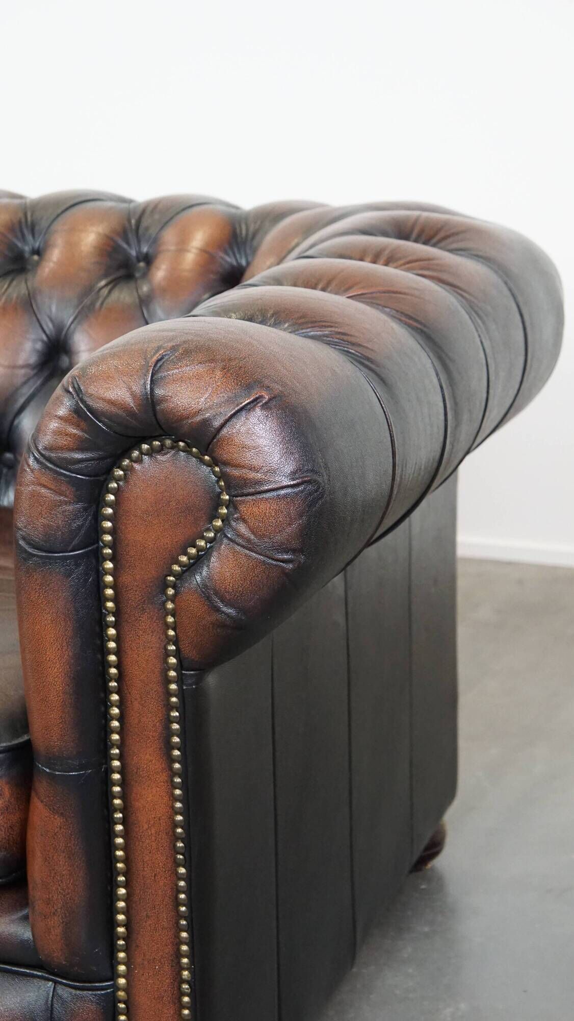 Classic English Chesterfield 2.5 seater sofa in brown cowhide