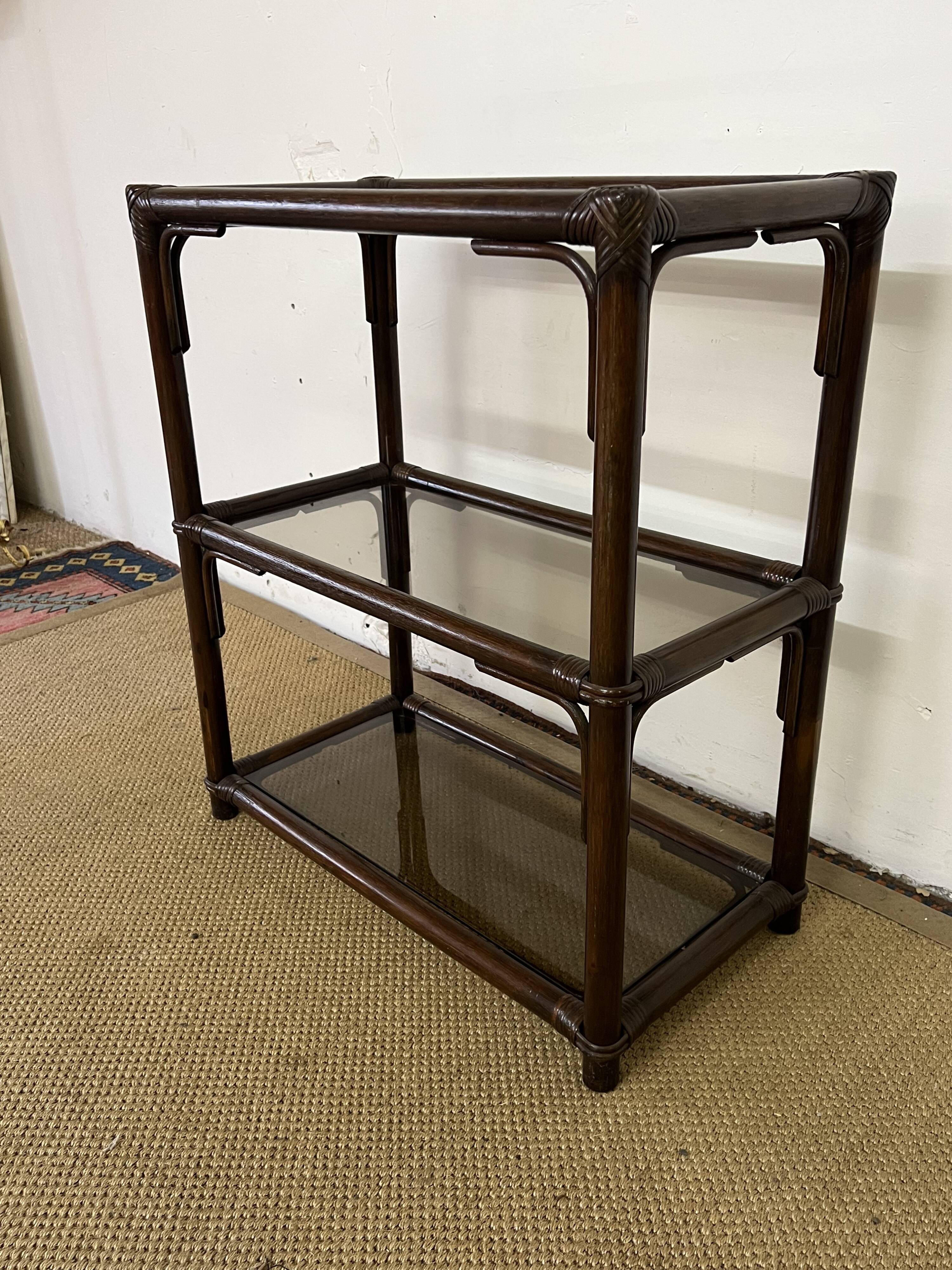 Rattan and smoked glass bookcase shelf