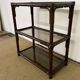 Rattan and smoked glass bookcase shelf
