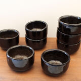 Set of 8 black ceramic cups signed