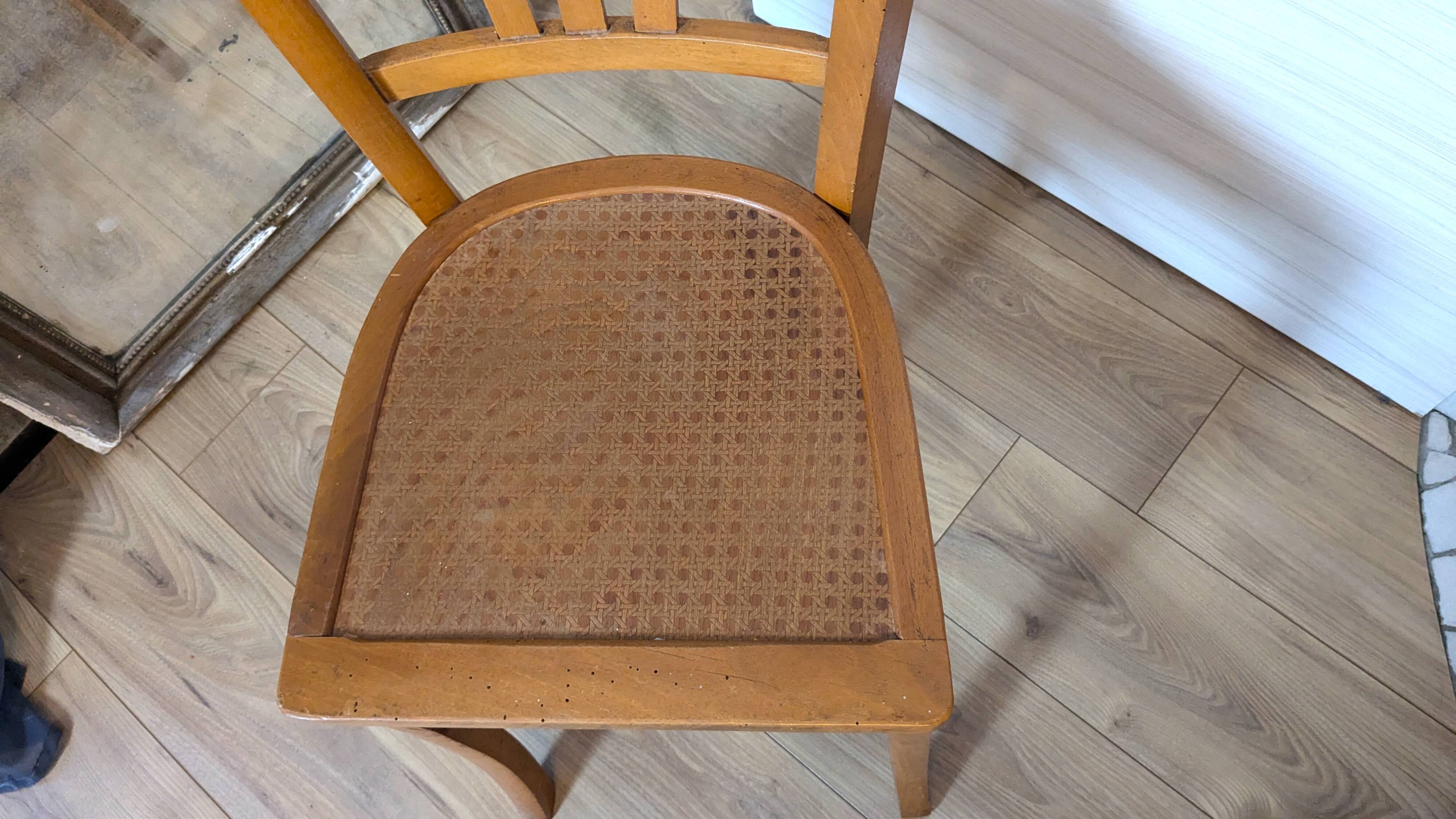 Antique patinated wooden bistro chair from the early 20th century.