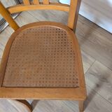 Antique patinated wooden bistro chair from the early 20th century.