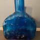 Blue molded glass bottle