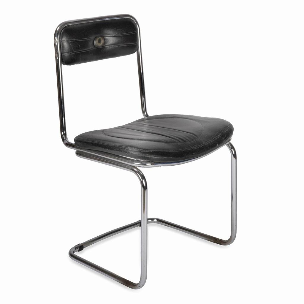 Tube chair with chrome steel base and seat and backrest made of soft black leatherette.