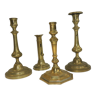 Set of four brass candle holders