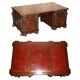 Partner desk with two carved columns featuring lion heads, according to Thomas Chippendale, restored.
