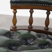 Dark green cowhide leather and wood chesterfield office chair on wheels