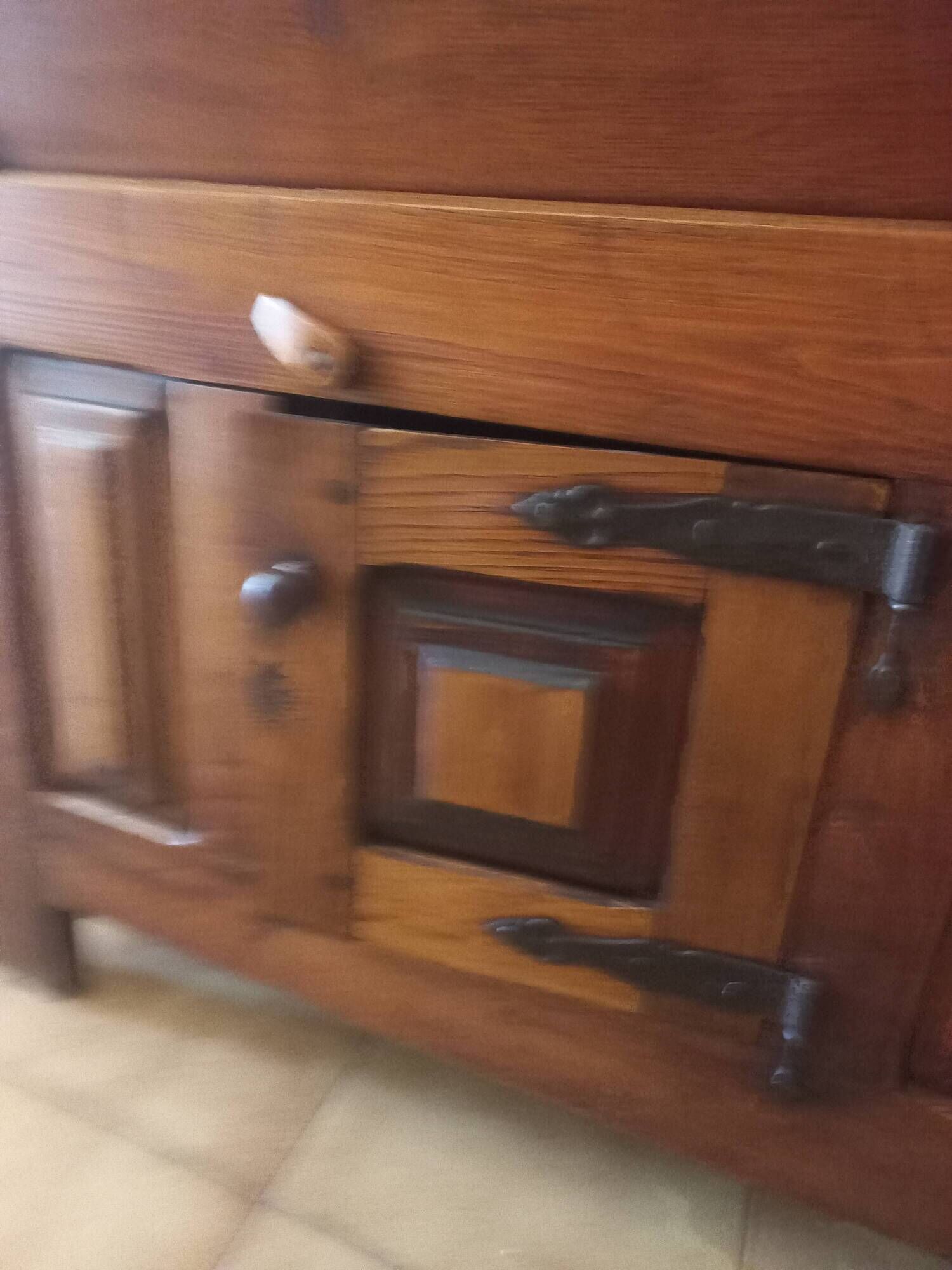 Old solid wood dough mixer carefully transformed into a bar cabinet.