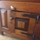 Old solid wood dough mixer carefully transformed into a bar cabinet.