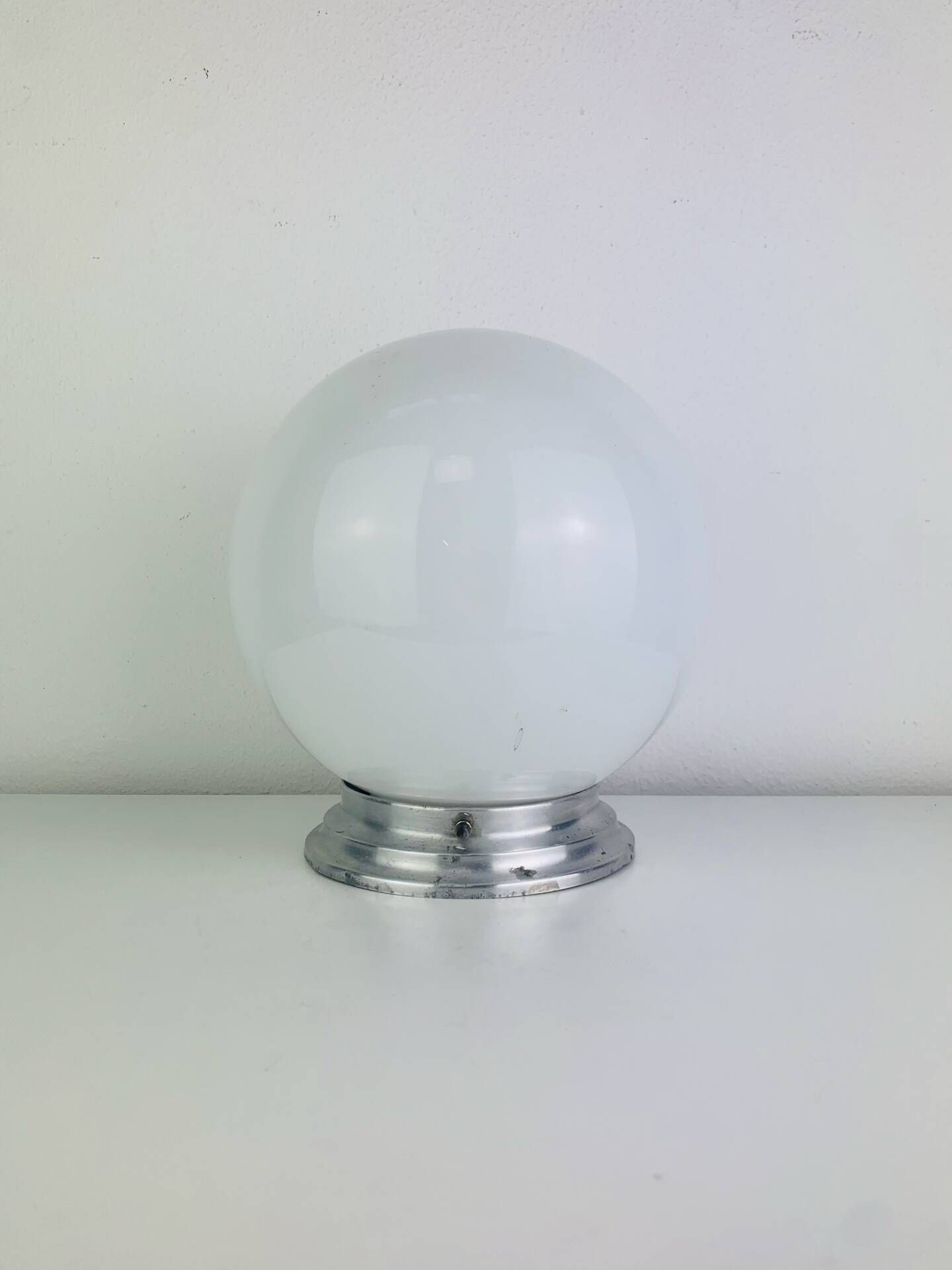 Wall light or ceiling light with opaline globe in Art Deco style.