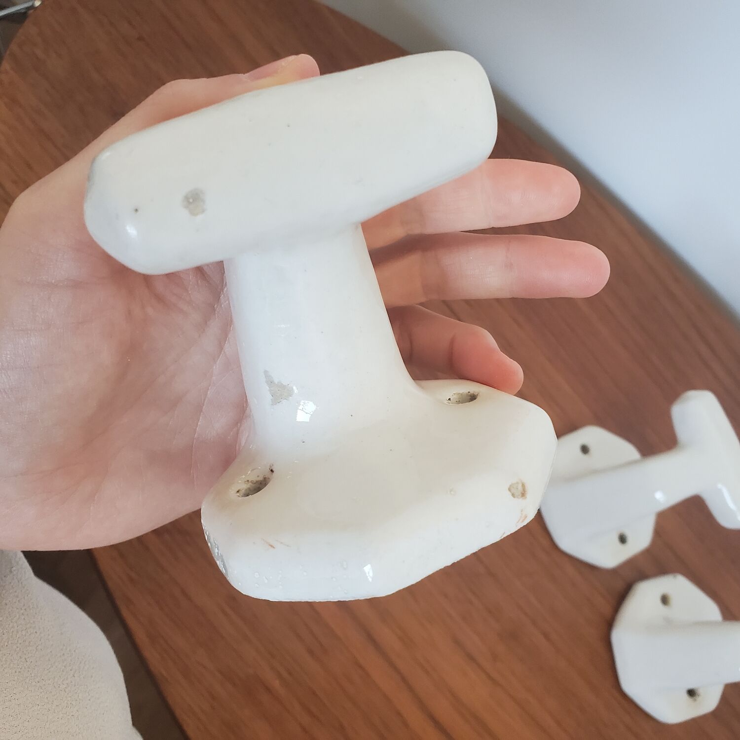 Trio of white porcelain hooks