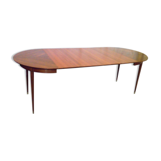 Mahogany round table with 4 extensions from the 1950s