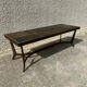Coffee table with stone top and iron legs