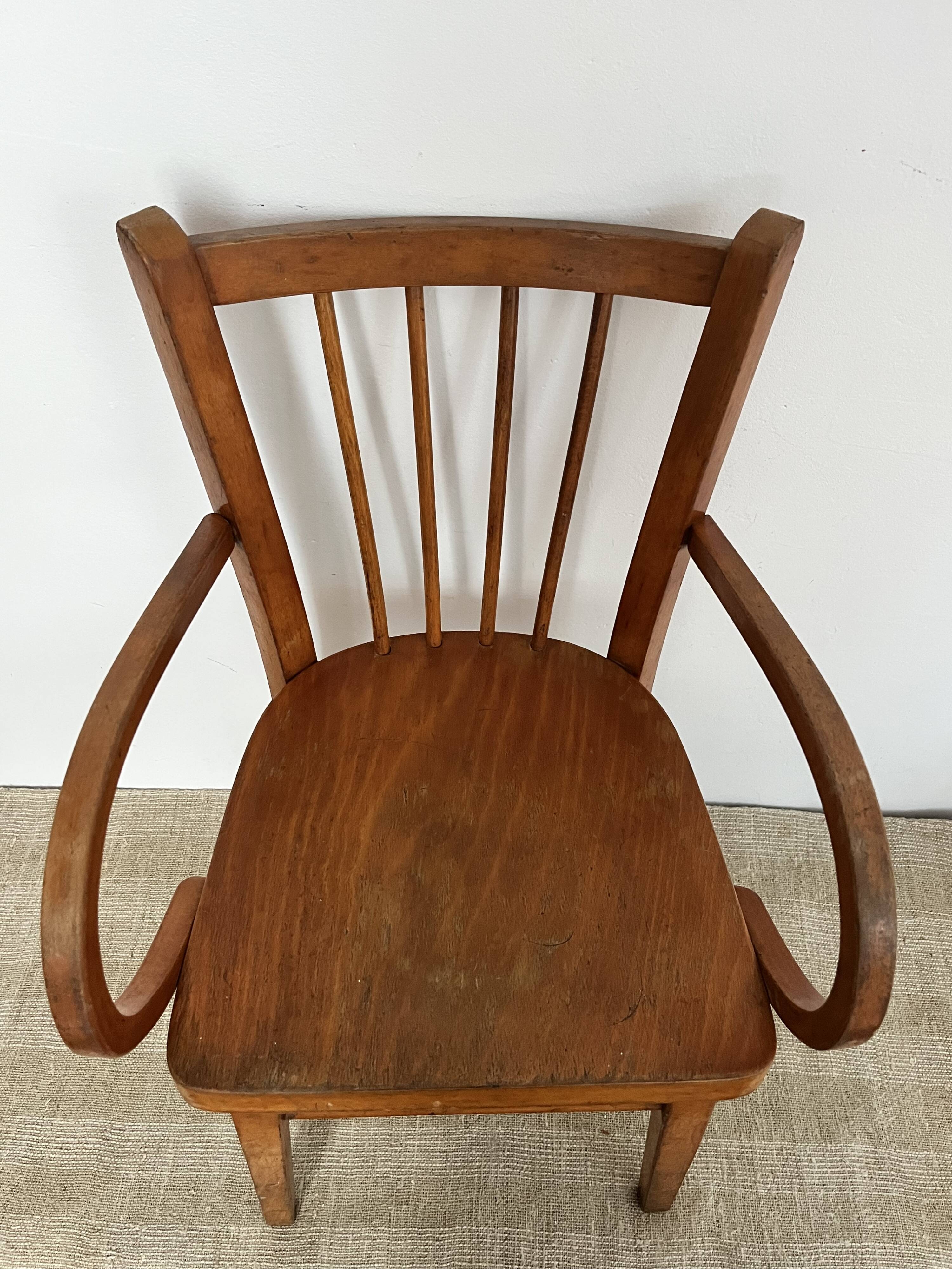 Curved wooden child's armchair - early 20th century