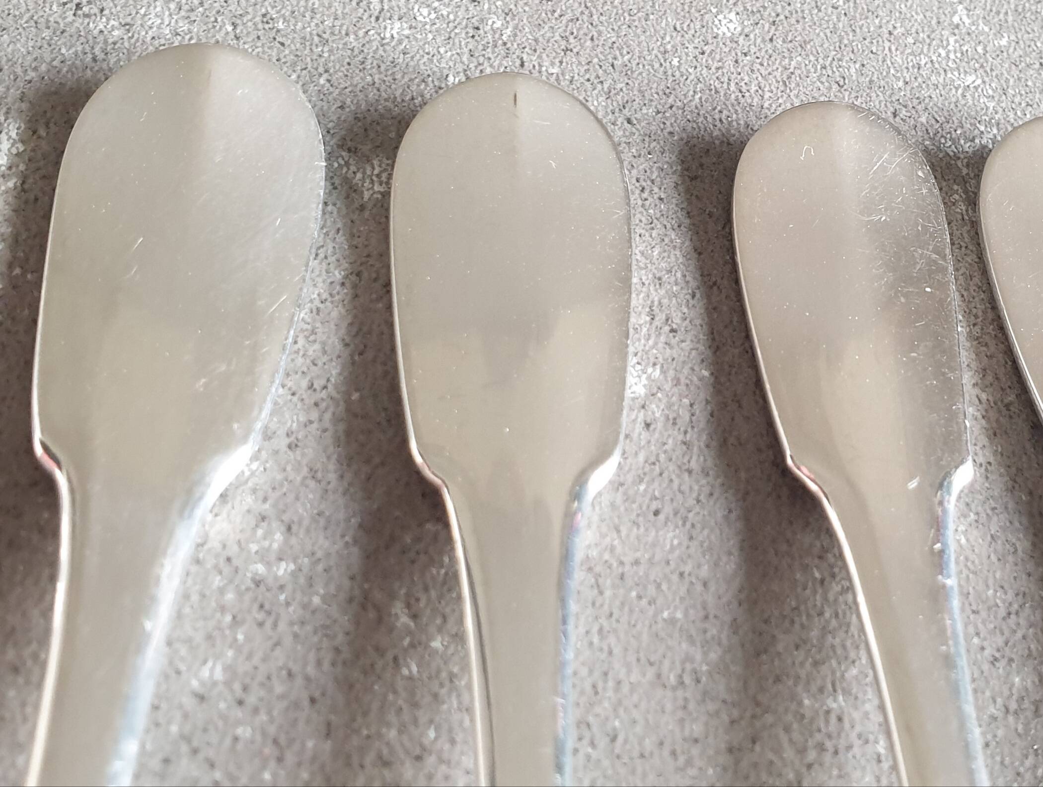 Set of 12 dessert forks and a cake server.
