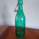 Bottle with green lemonade