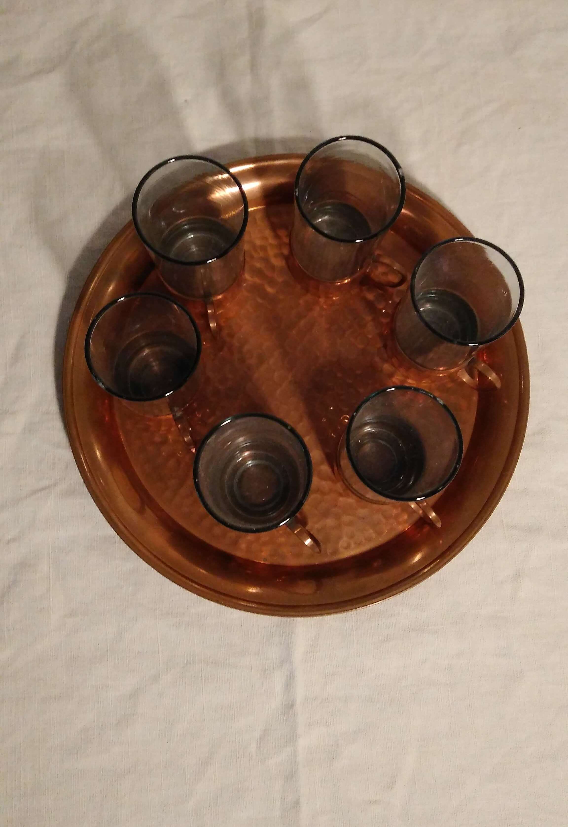 Liquor service or glass and copper tea