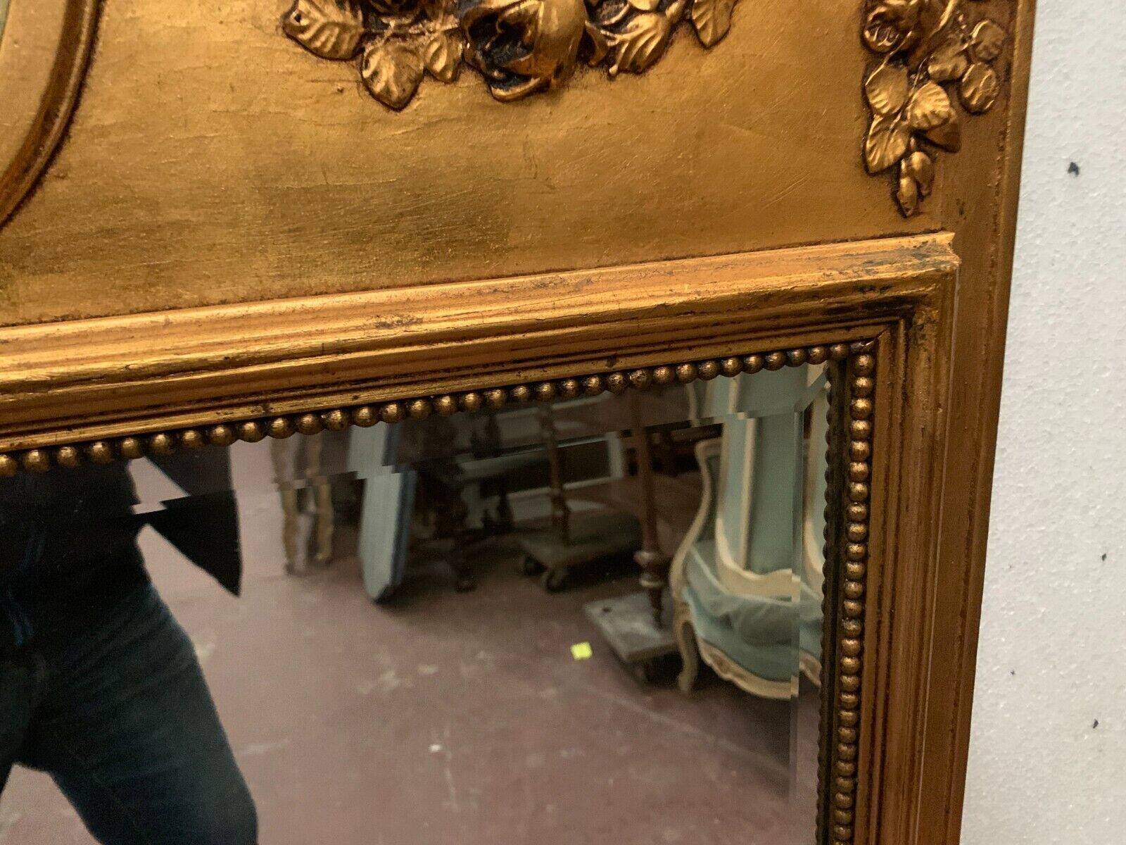Louis XVI style mirror in wood and gilded stucco 20th century