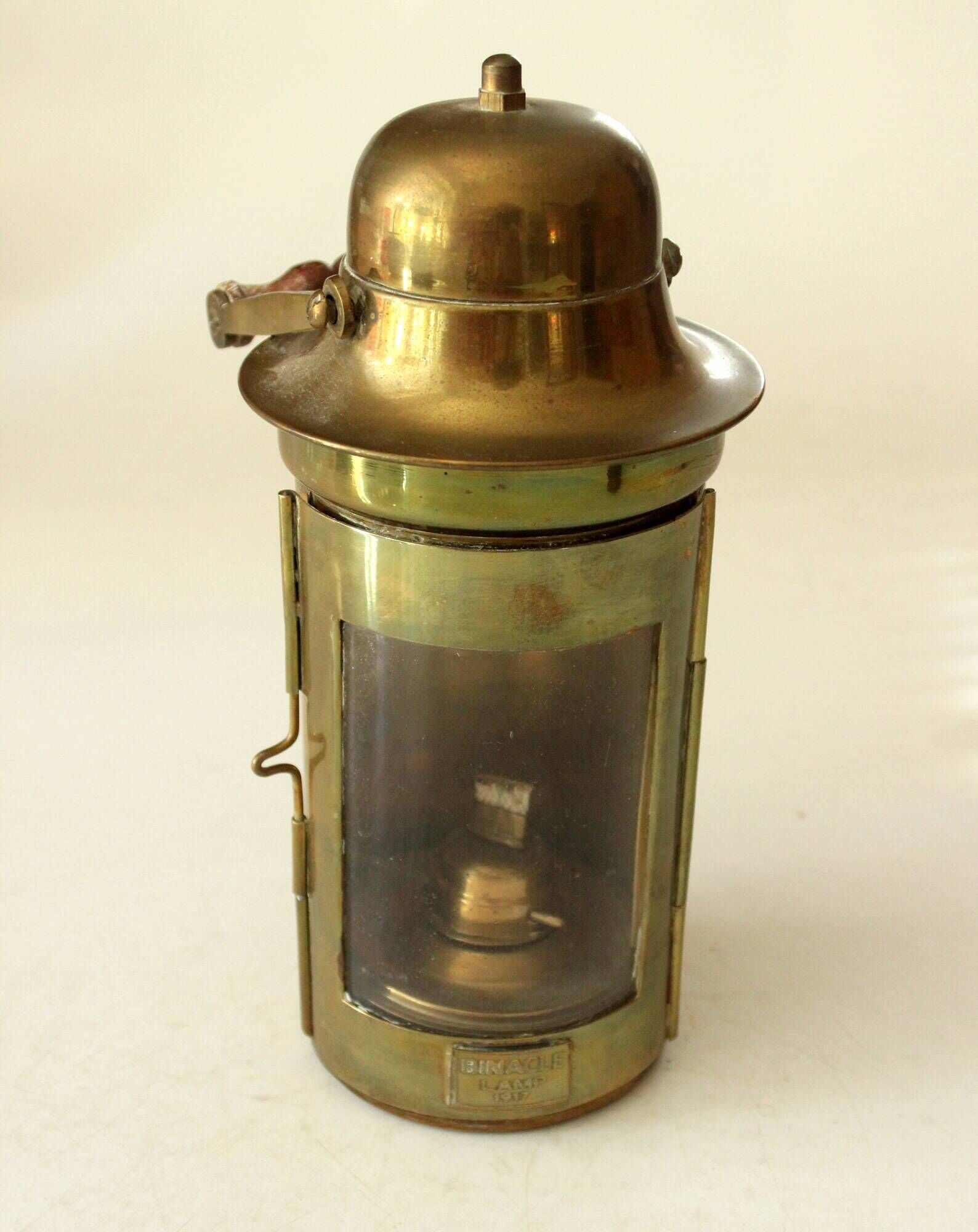 Decorative brass and glass oil lamp, wind light with wooden handle, vintage from the 1970s