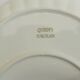 Shell-shaped porcelain pocket bowl from Queen’s Porcelain, with a gold rim.