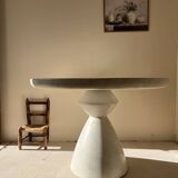 Travertine-effect stone dining table