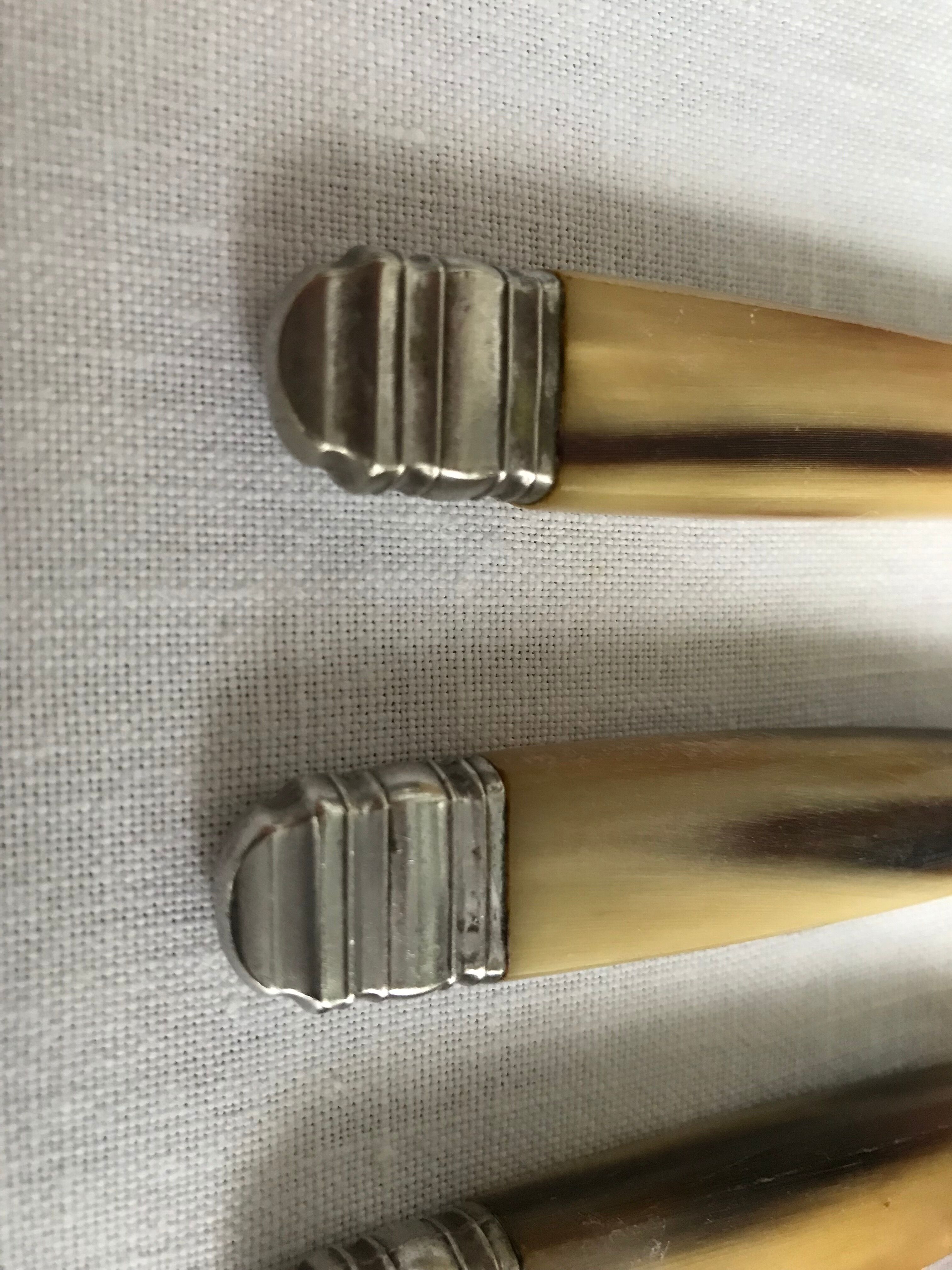 Twelve Art Deco horn and silver knives