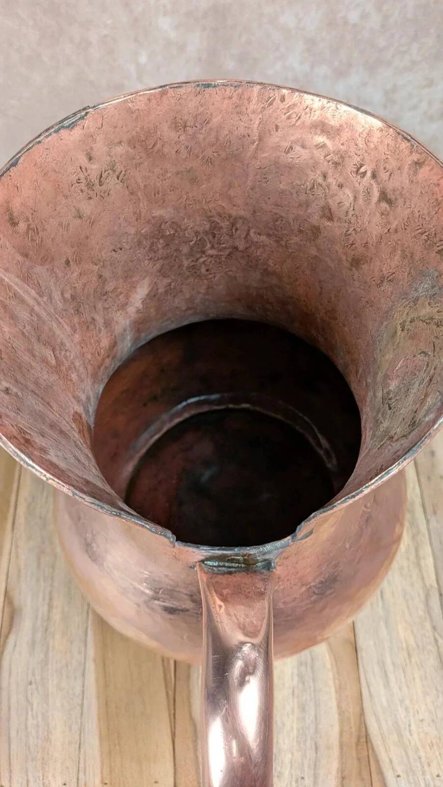 Antique hammered copper jug