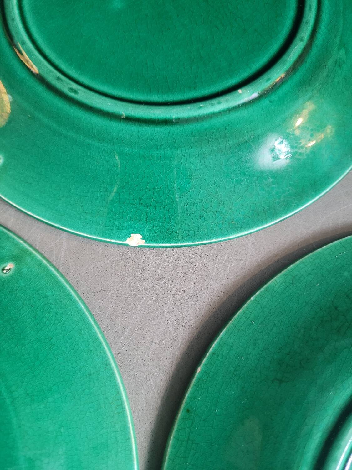 Three green slip plates