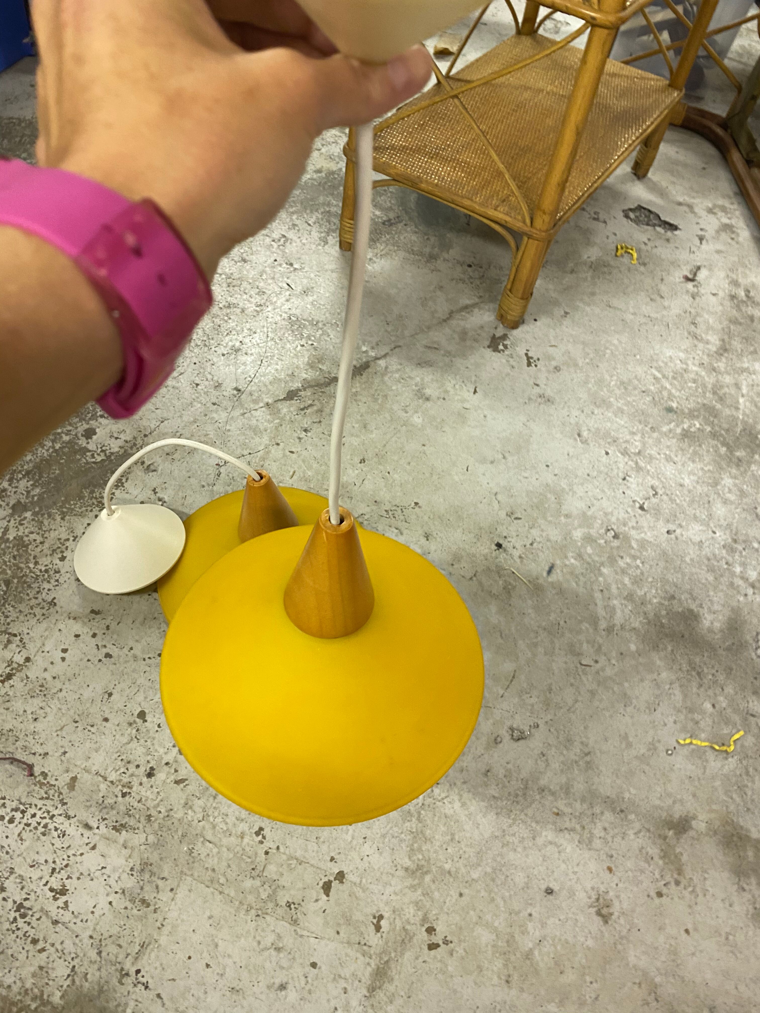 Duo of yellow glass pendant lamps