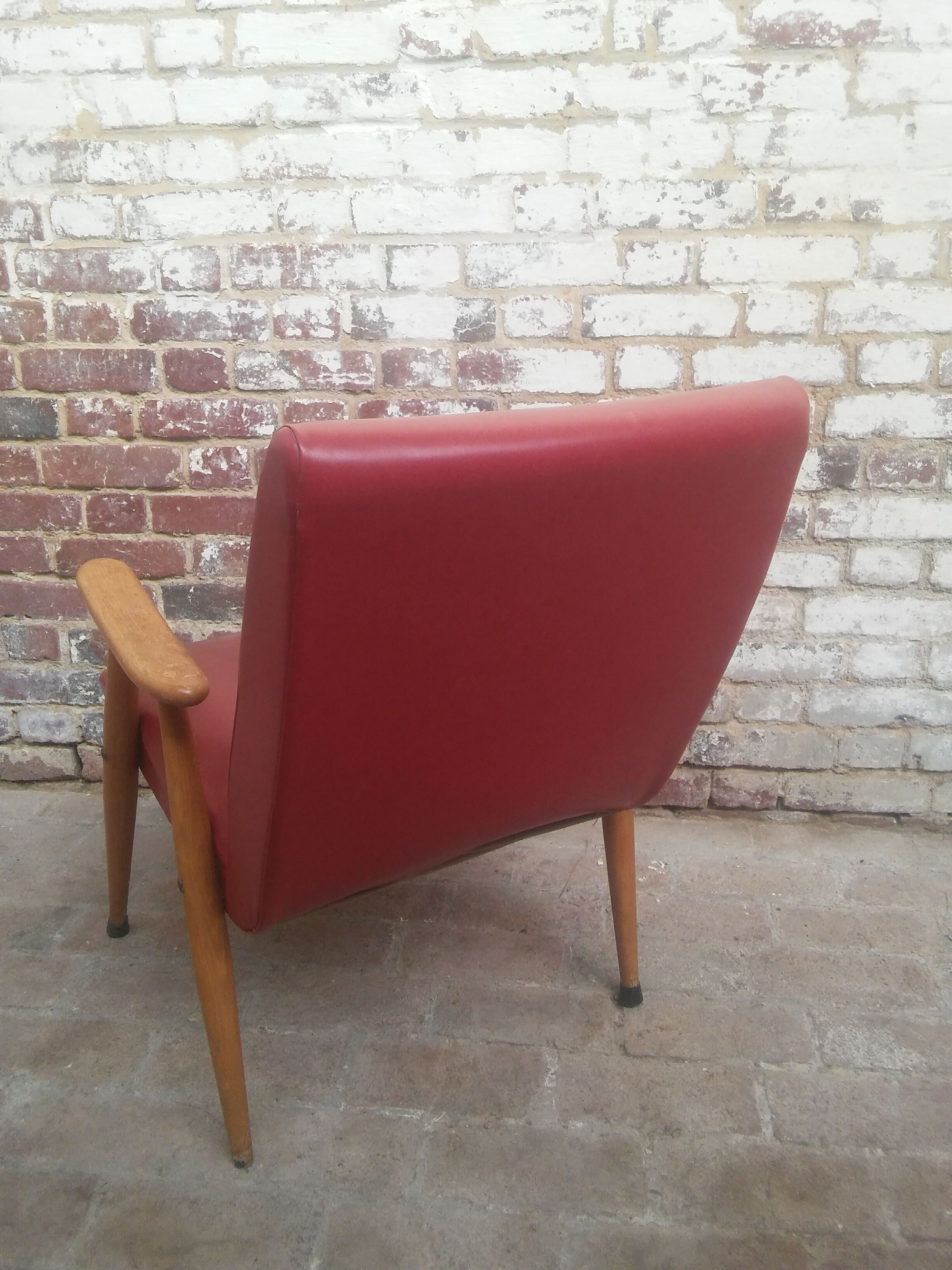 Red armchair with compass feet 50s