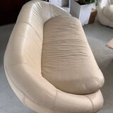 2 seater leather sofa in off-white with a rounded shape