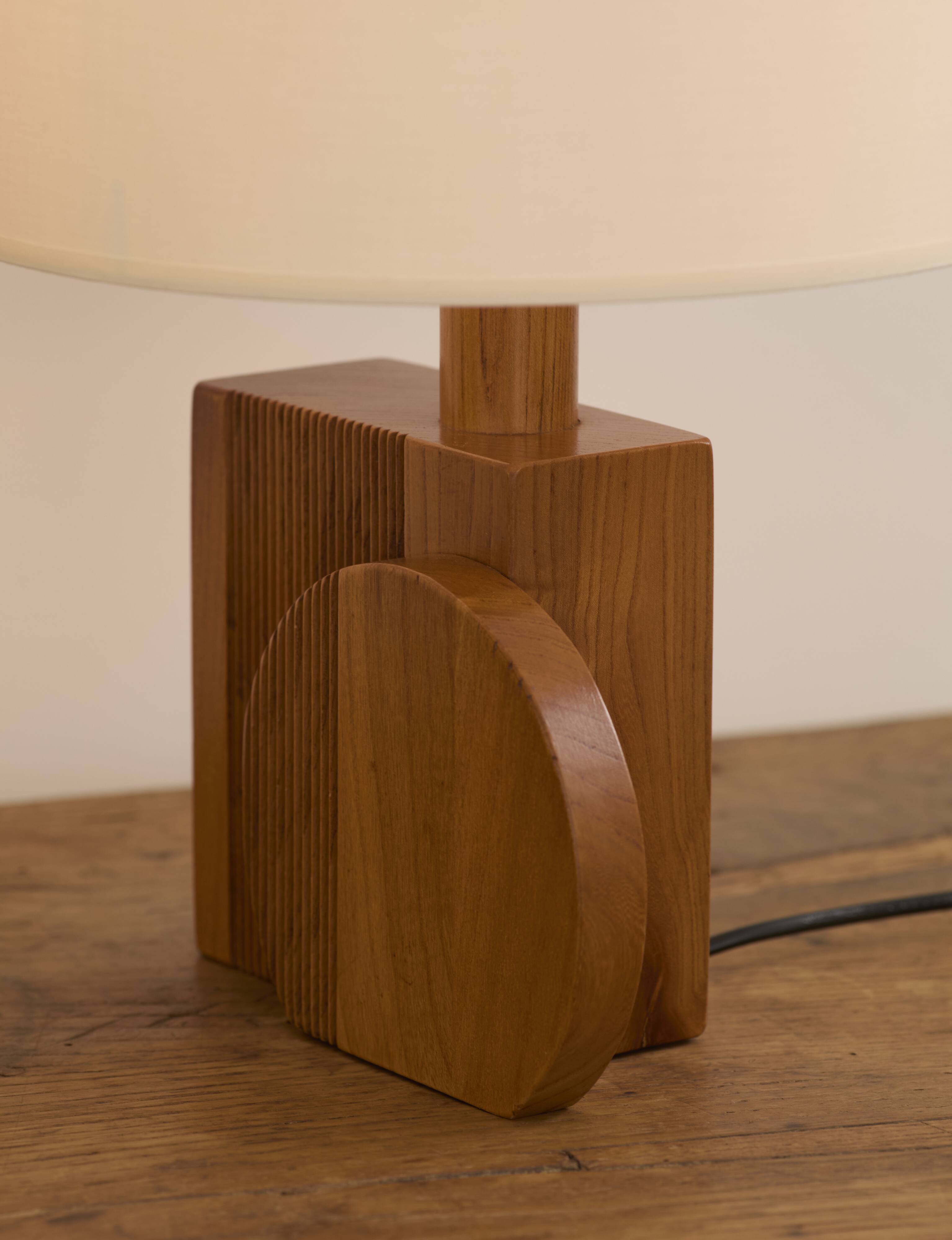 Pair of geometric handcrafted lamps in solid oak circa 1970.