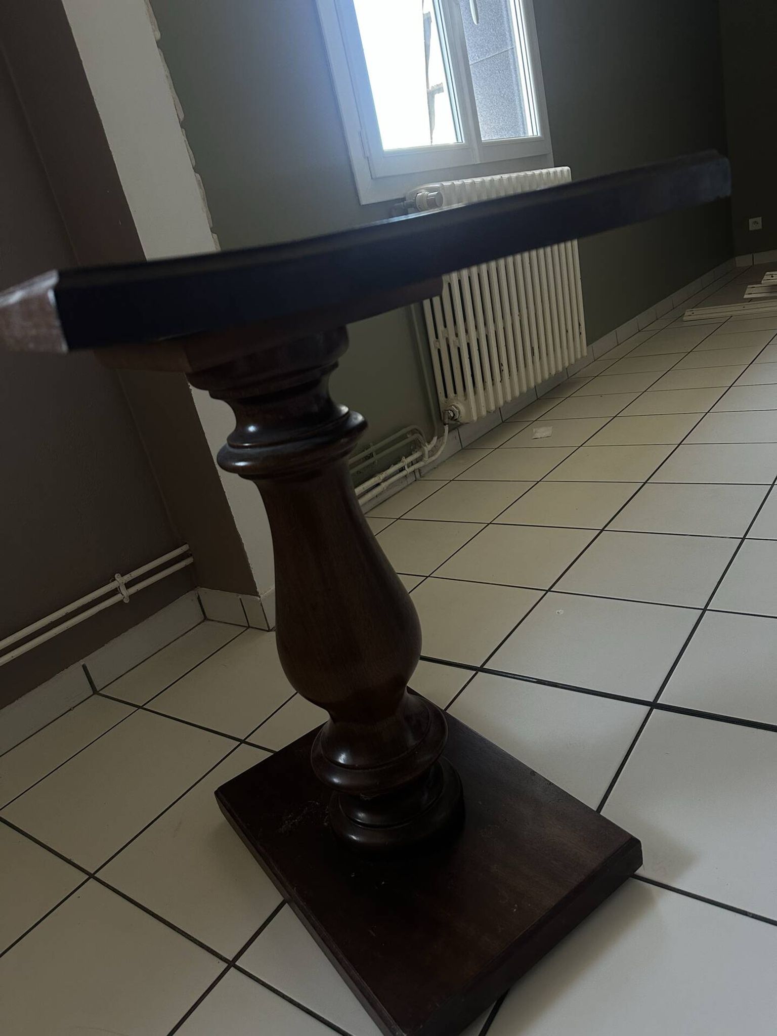 Small wooden bistro table with a turned central leg.