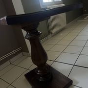 Small wooden bistro table with a turned central leg.