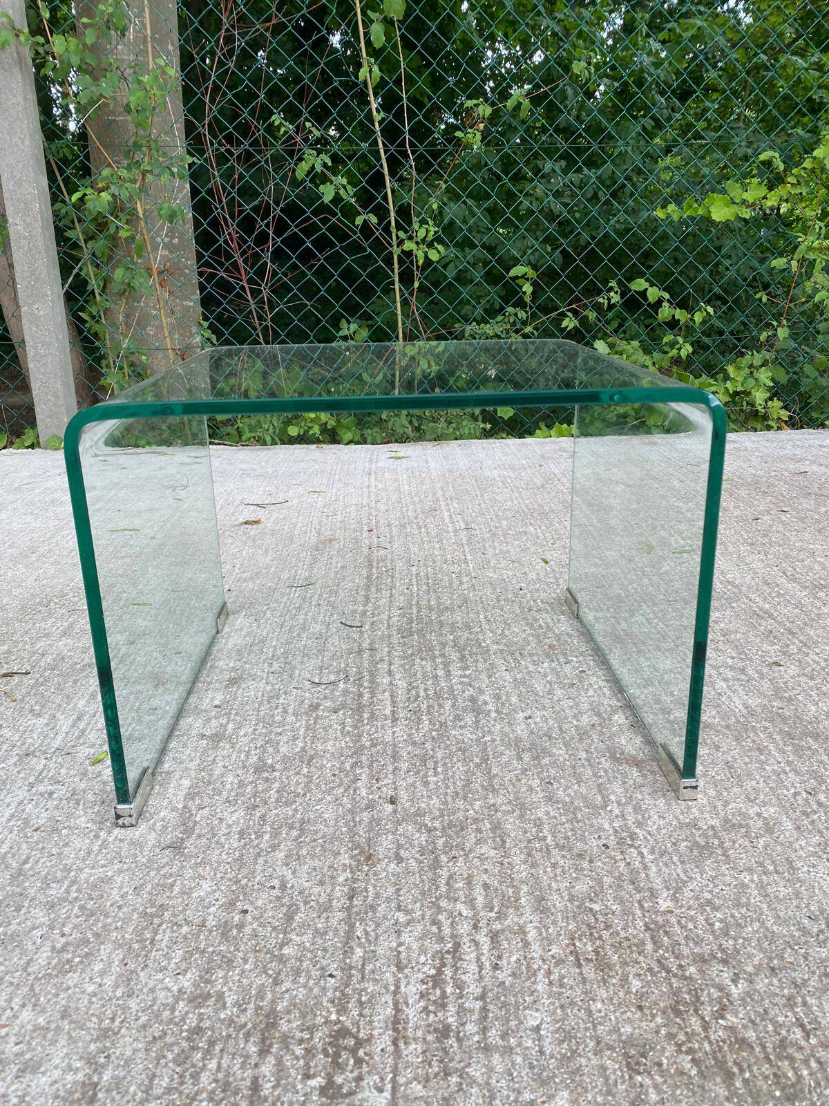 Vintage Italian coffee table with curved glass from the 1980s.