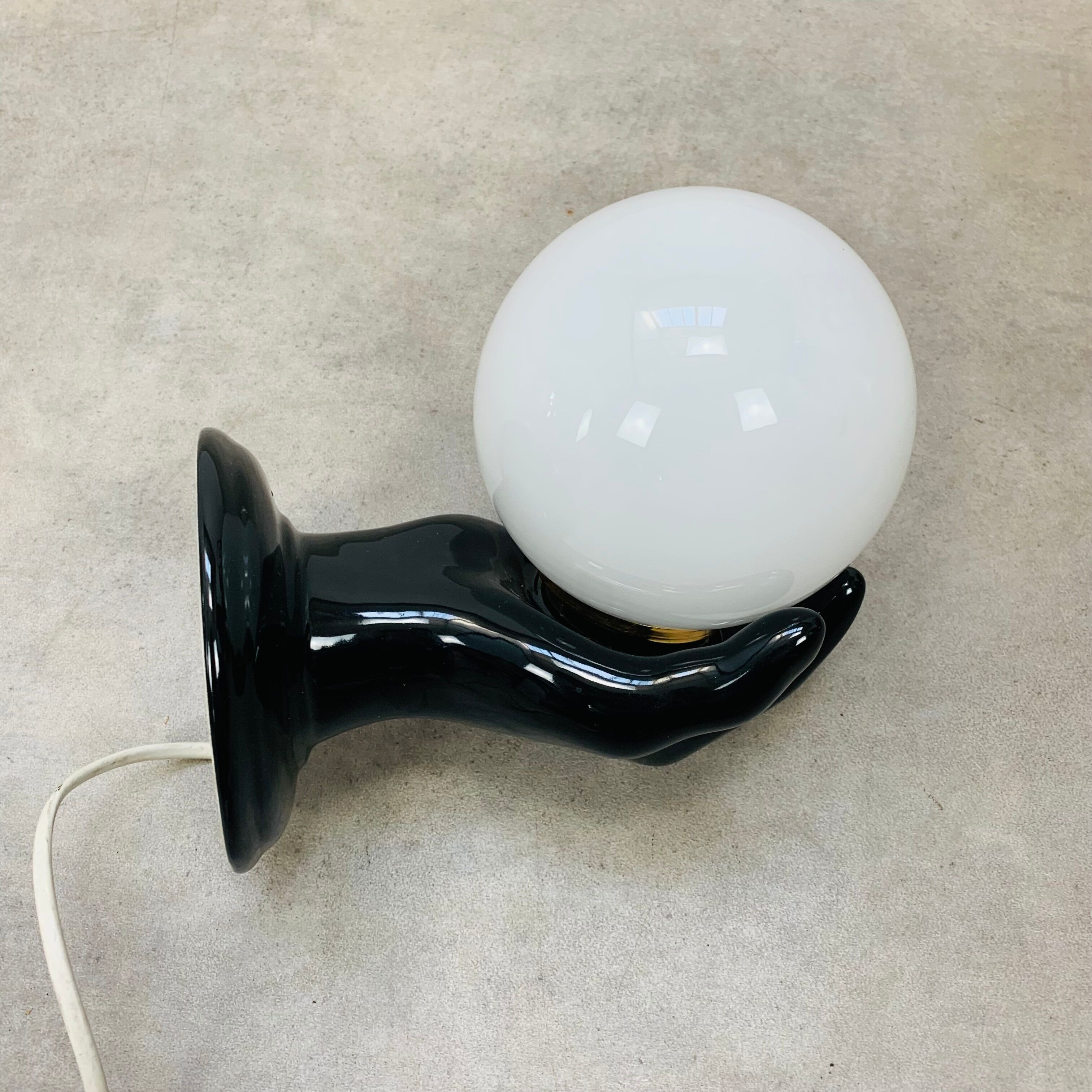 Black and opaline ceramic hand lamp