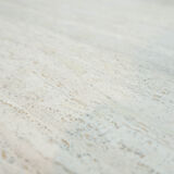 Round Belgian travertine dining table