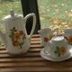 Porcelain dinette for dolls consisting of a coffee maker, cups and saucers, vintage