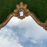 Old mirror in carved wood and gilded leaf, Louis XV rocaille style, twentieth century 59x87cm
