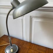 Industrial metal workshop lamp with a gooseneck.