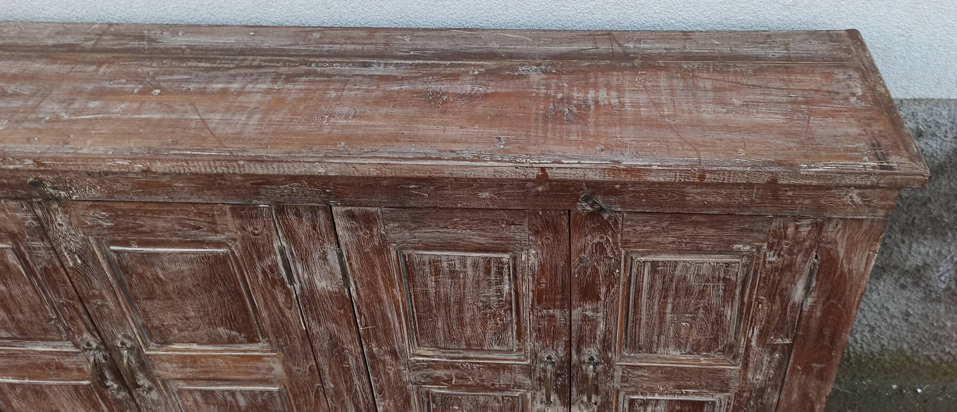 Old wooden sideboard with 4 doors